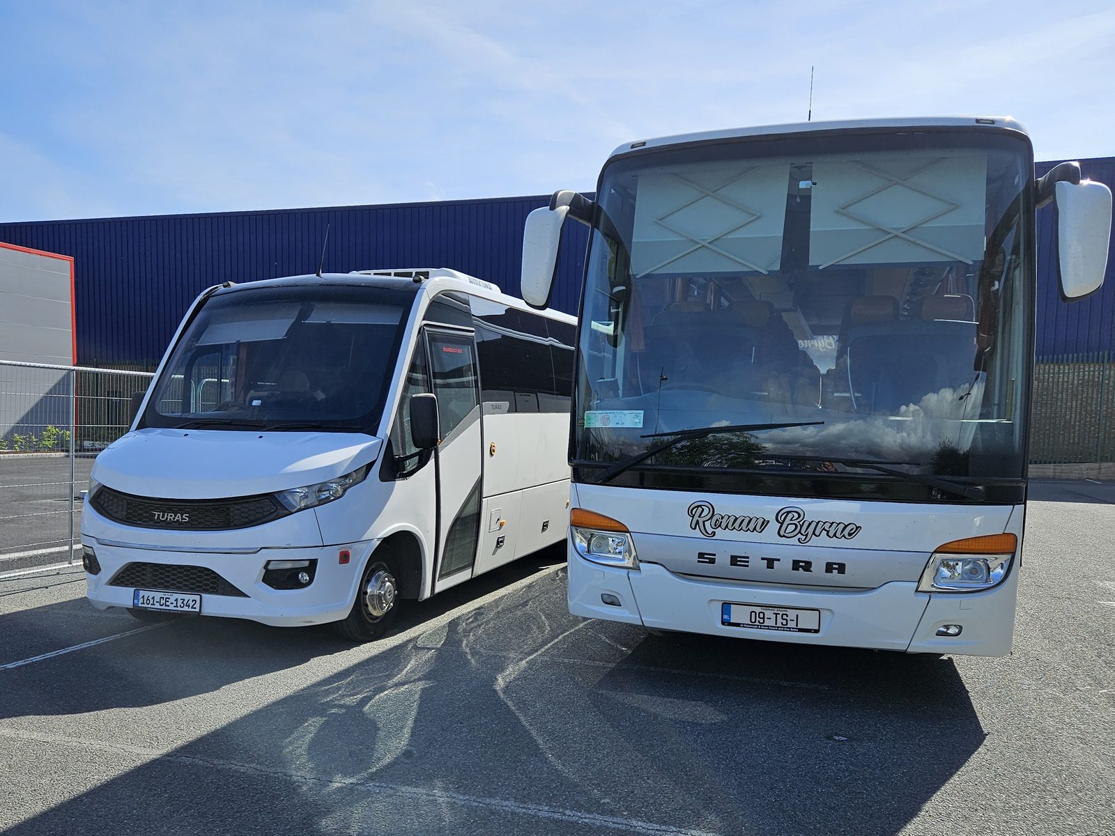 Two of the RSC Buses fleet, a Setra coach and a midi-coach, parked side by side