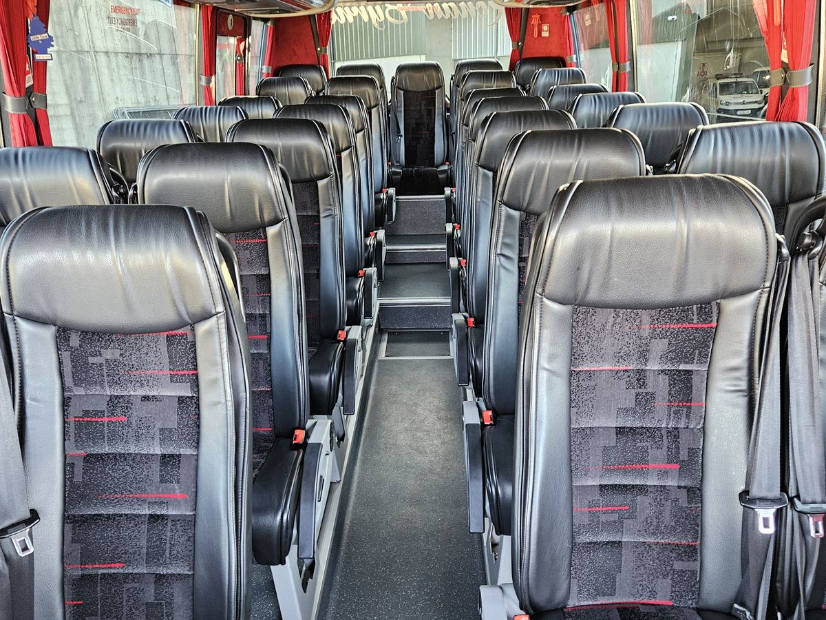 Inside one of the coaches, reclining seats with belts