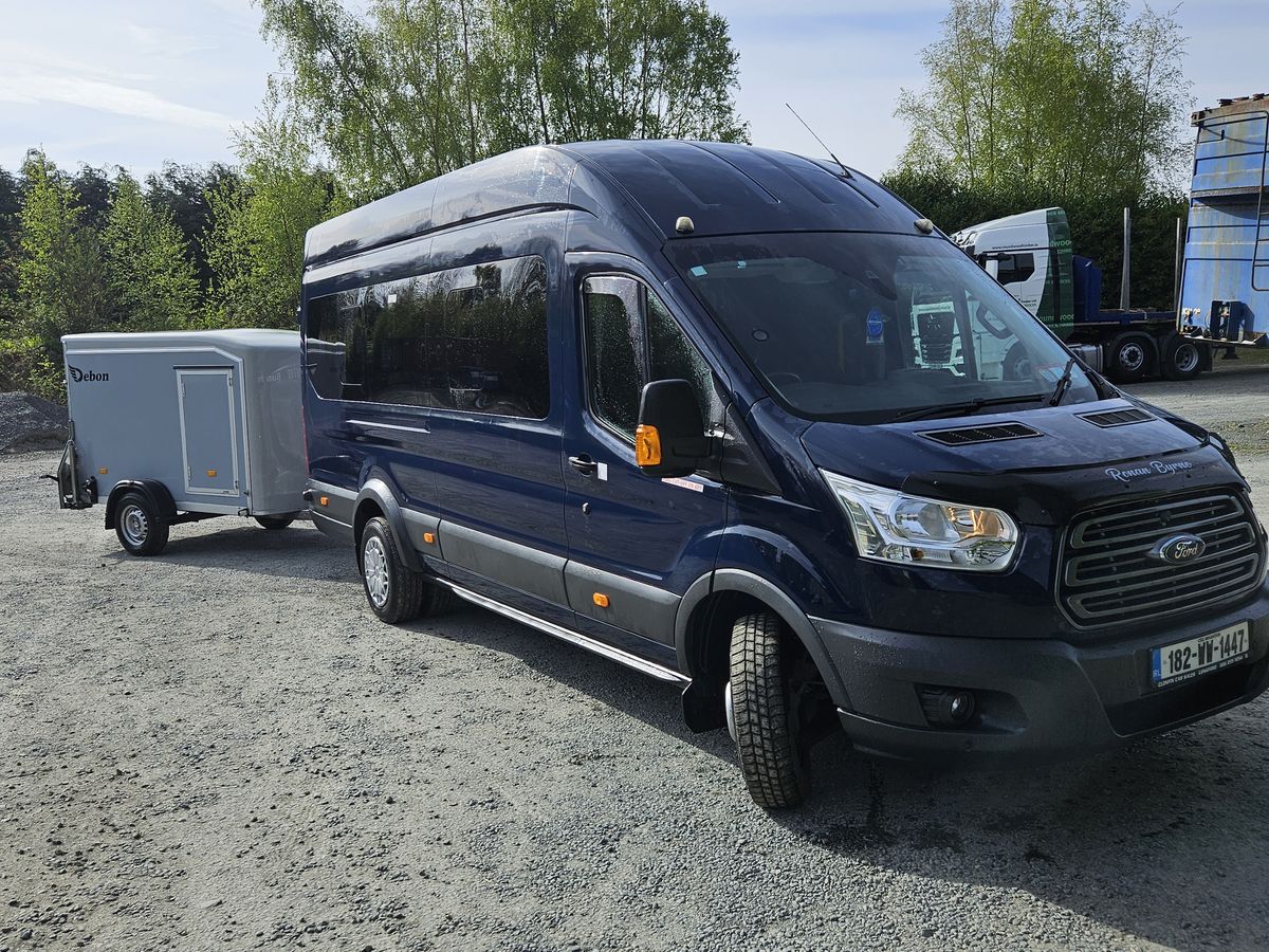 Minibus and luggage trailer ready for an airport group